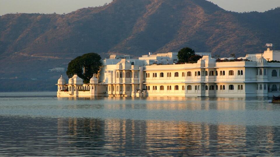 White Lake Palace floating on Lake Pichola in Udaipur at sunset