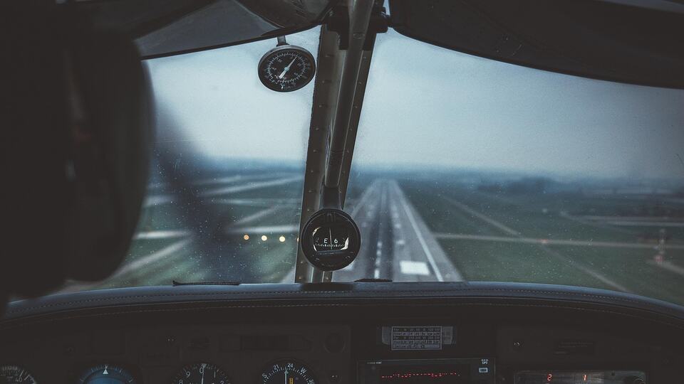 View from an aircraft cockpit on approach to the runway
