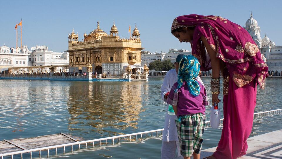 Pilgrims beside the sacred pool of the Golden Temple in Amritsar