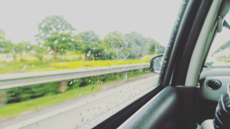 Raindrops on a car window during the monsoon in southern India