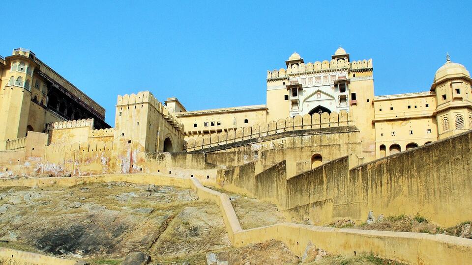 Amber Fort near Jaipur under a clear blue sky in the dry season