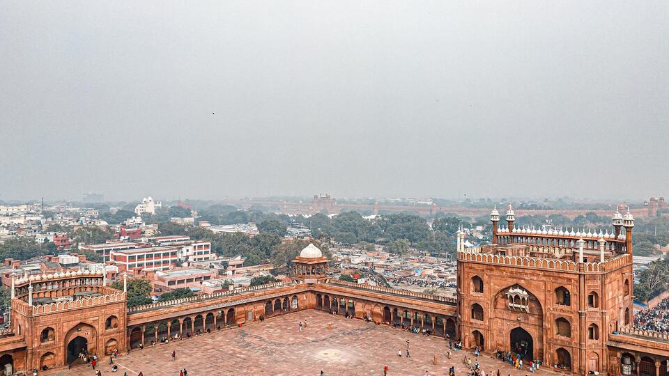 Red sandstone minaret of Jama Masjid rising above the rooftops of Old Delhi