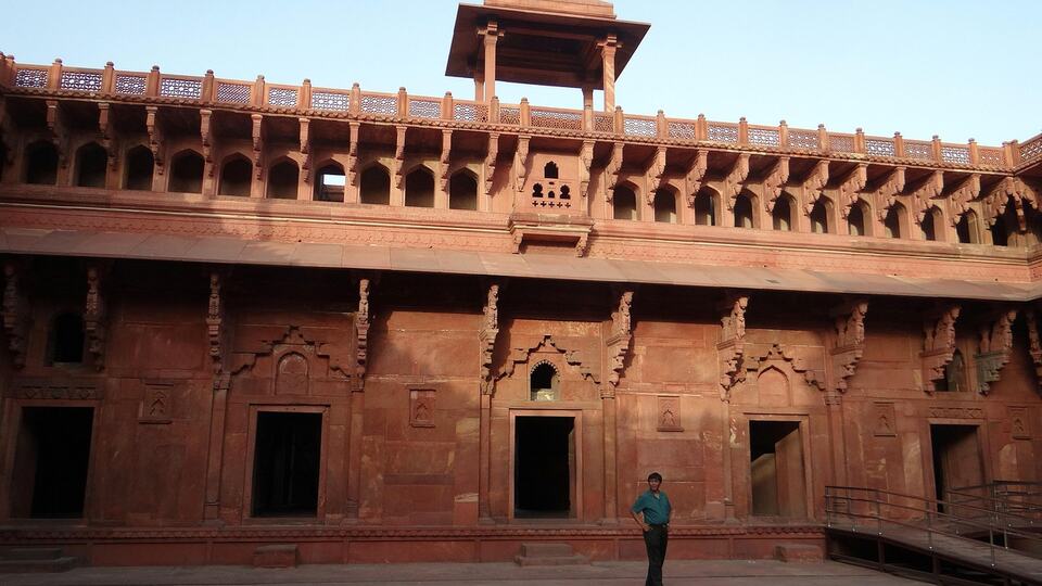 Massive red sandstone walls and gateway of Agra Fort
