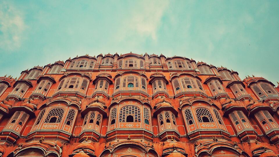 The pink honeycomb facade of Hawa Mahal, the Palace of Winds in Jaipur