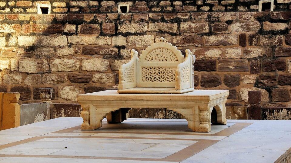 Ornate marble throne inside a palace of Jaisalmer
